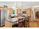 An eat-in kitchen featuring light wood cabinets, stainless steel appliances, and a large island at 4649 Dahlia Dr, Pine Lake, GA 30072