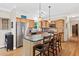 An eat-in kitchen featuring light wood cabinets, stainless steel appliances, and a large island at 4649 Dahlia Dr, Pine Lake, GA 30072