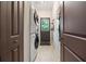 A laundry room with a stacked washer and dryer unit at 4649 Dahlia Dr, Pine Lake, GA 30072