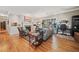 Bright living room with hardwood floors, fireplace, and built-in shelving at 4649 Dahlia Dr, Pine Lake, GA 30072