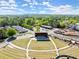 Aerial view of the community amphitheater, showcasing nearby local shops and parking spaces at 7059 Hunters Rdg, Woodstock, GA 30189