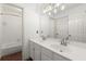 Bathroom features double sink vanity, large mirror, tub, shower, and neutral decor at 7059 Hunters Rdg, Woodstock, GA 30189