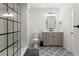 Bathroom with elegant shower, modern vanity, updated fixtures, and patterned tile floor at 7059 Hunters Rdg, Woodstock, GA 30189