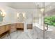 Bright bathroom featuring dual vanities, a soaking tub, and a glass shower at 7059 Hunters Rdg, Woodstock, GA 30189