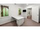 This bedroom features a built-in desk, bright windows and neutral walls at 7059 Hunters Rdg, Woodstock, GA 30189
