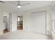 Neutral bedroom featuring bright natural light, plush carpeting, and closet at 7059 Hunters Rdg, Woodstock, GA 30189