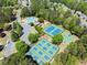 Aerial shot of neighborhood amenities with tennis courts, basketball court, playground, and swimming pool at 7059 Hunters Rdg, Woodstock, GA 30189