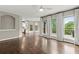 Open living area with access to the kitchen and outdoor deck, perfect for entertaining at 7059 Hunters Rdg, Woodstock, GA 30189
