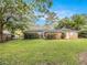 Expansive backyard with lush green lawn and mature trees providing privacy and shade for relaxation at 894 Nottingham Dr, Avondale Estates, GA 30002