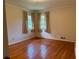 Cozy bedroom with hardwood floors and natural light from two windows at 894 Nottingham Dr, Avondale Estates, GA 30002