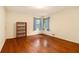 Bright bedroom with hardwood floors, a bookshelf, and ample natural light at 894 Nottingham Dr, Avondale Estates, GA 30002