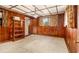 Cozy bedroom with wood-paneled walls and a ceiling light at 894 Nottingham Dr, Avondale Estates, GA 30002