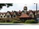 Exterior view of charming Tudor-style buildings with striking architectural details and lush landscaping at 894 Nottingham Dr, Avondale Estates, GA 30002