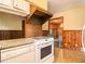 Practical kitchen featuring tile floor and vintage vent hood at 894 Nottingham Dr, Avondale Estates, GA 30002