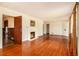 Spacious living room features hardwood floors, a cozy fireplace, and plenty of natural light at 894 Nottingham Dr, Avondale Estates, GA 30002