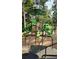 Accessible playground with green slides, climbing structures, and a protective surface at 894 Nottingham Dr, Avondale Estates, GA 30002
