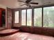 Bright sunroom with brick accent walls, large windows, and a ceiling fan at 894 Nottingham Dr, Avondale Estates, GA 30002