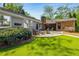 Manicured backyard with a stone patio and well-maintained lawn at 1041 Standard Ne Dr, Brookhaven, GA 30319