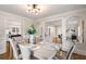 Elegant dining room with hardwood floors, stylish decor, and seamless flow into the adjacent living areas at 1041 Standard Ne Dr, Brookhaven, GA 30319