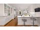 Bright kitchen features white cabinetry, marble countertops, stainless appliances, and hardwood floors at 1041 Standard Ne Dr, Brookhaven, GA 30319