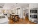 Bright kitchen features white cabinetry, marble countertops, stainless appliances, and hardwood floors at 1041 Standard Ne Dr, Brookhaven, GA 30319