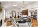 Stylish living room features a high ceiling, a fireplace, hardwood floors, and lots of natural light at 1041 Standard Ne Dr, Brookhaven, GA 30319