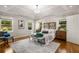 Spacious main bedroom features a tray ceiling, hardwood floors, lots of natural light, and modern decor at 1041 Standard Ne Dr, Brookhaven, GA 30319
