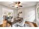 Home office features natural light, hardwood floors, ceiling fan, and modern decor at 1041 Standard Ne Dr, Brookhaven, GA 30319