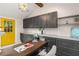 Home office featuring gray cabinets, a yellow door, and dark wood desk at 1041 Standard Ne Dr, Brookhaven, GA 30319