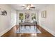 Cozy home office with natural light, hardwood floors, ceiling fan, and modern decor at 1041 Standard Ne Dr, Brookhaven, GA 30319