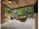Covered patio with comfortable seating and backyard with a lush lawn at 1041 Standard Ne Dr, Brookhaven, GA 30319