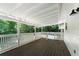Spacious back porch includes a view of the backyard and surrounding trees at 128 Reynolds Bridge Rd, Kingston, GA 30145