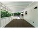 Relaxing back porch features a wooden floor and a view of the backyard at 128 Reynolds Bridge Rd, Kingston, GA 30145