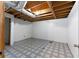 Unfinished basement features an open ceiling, concrete floor, and window at 128 Reynolds Bridge Rd, Kingston, GA 30145