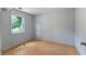 Cozy bedroom with hardwood floors and a window overlooking the yard at 128 Reynolds Bridge Rd, Kingston, GA 30145