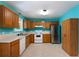 Well-lit kitchen with stainless steel refrigerator, range, dishwasher and plenty of storage at 128 Reynolds Bridge Rd, Kingston, GA 30145
