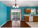 Cozy kitchen with wooden cabinets, a view of the deck and hardwood floors at 128 Reynolds Bridge Rd, Kingston, GA 30145