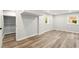 Finished basement featuring luxury vinyl plank flooring, neutral paint and ample natural light at 163 Oakcliff Ct, South Fulton, GA 30331