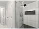 Modern bathroom features an open, glass-enclosed shower with sleek, contemporary tile work at 163 Oakcliff Ct, South Fulton, GA 30331