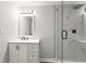 Bathroom with a modern vanity, frameless glass shower, matte black fixtures, and marble-style tiling at 163 Oakcliff Ct, South Fulton, GA 30331