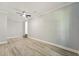 A spacious bedroom features light wood flooring and a ceiling fan at 163 Oakcliff Ct, South Fulton, GA 30331
