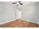 A bedroom with hardwood floors, ceiling fan, and a doorway leading to other rooms at 163 Oakcliff Ct, South Fulton, GA 30331