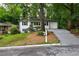 Charming white one-story home with landscaped front yard and inviting curb appeal at 163 Oakcliff Ct, South Fulton, GA 30331