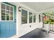 Inviting front entrance with blue door and white brick facade with large windows at 163 Oakcliff Ct, South Fulton, GA 30331