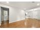 Spacious living room with hardwood floors and bright, open layout to the kitchen and bath at 163 Oakcliff Ct, South Fulton, GA 30331