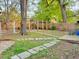 Landscaped backyard with stone walkways and a wooded playset at 23 Gould Se St, Atlanta, GA 30315