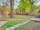 Picturesque backyard with stone pathways, mature trees, and a custom-built structure at 23 Gould Se St, Atlanta, GA 30315