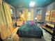 Cozy bedroom with stylish accents, chandelier lighting and colorful decor at 23 Gould Se St, Atlanta, GA 30315