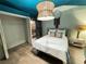 Charming bedroom with unique lighting, closet and door to another room at 23 Gould Se St, Atlanta, GA 30315