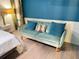 Bedroom sitting area featuring cozy sofa, throw pillows, and side table at 23 Gould Se St, Atlanta, GA 30315